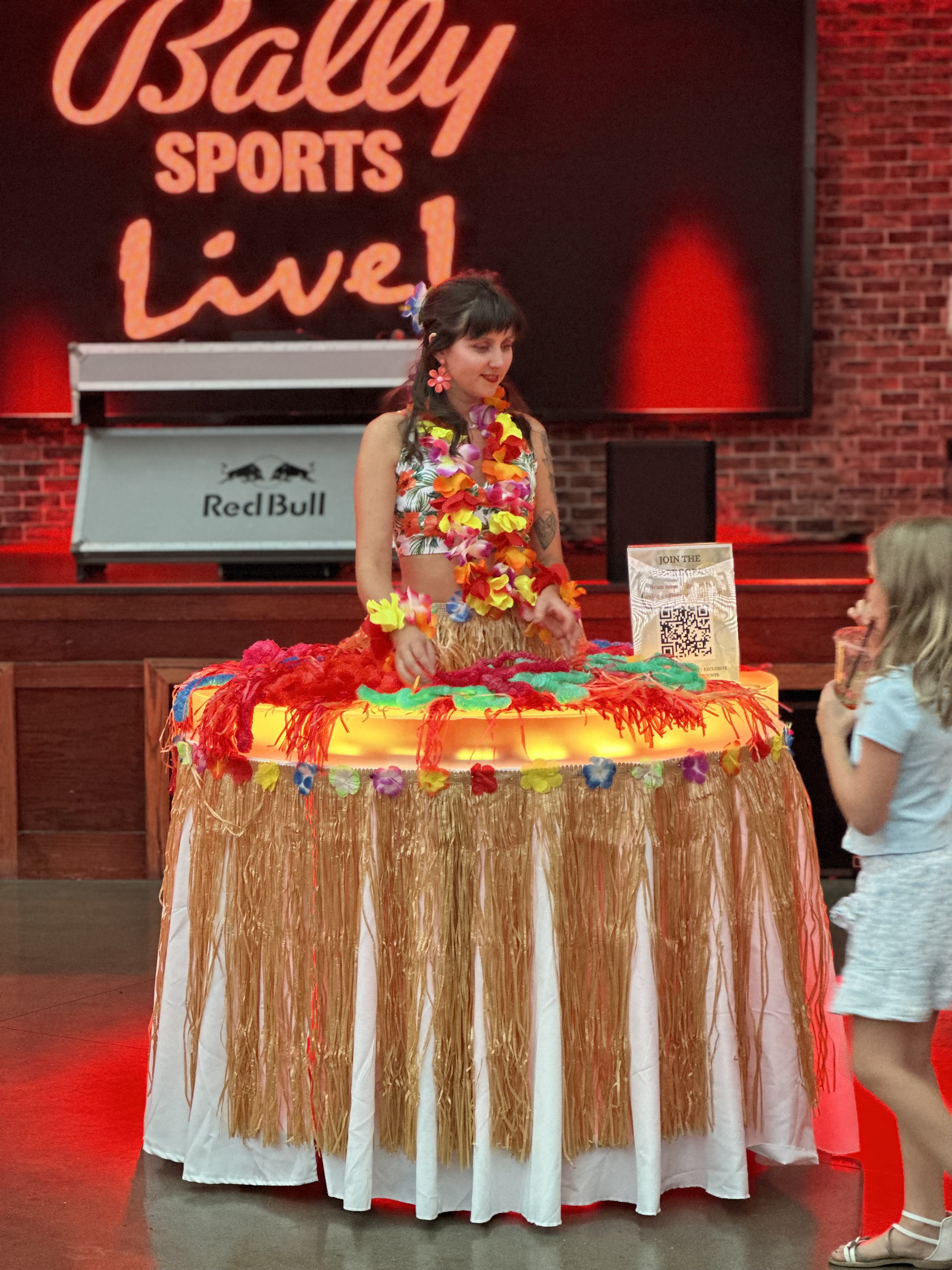 Luau Hawaiian themed strolling table grass skirts