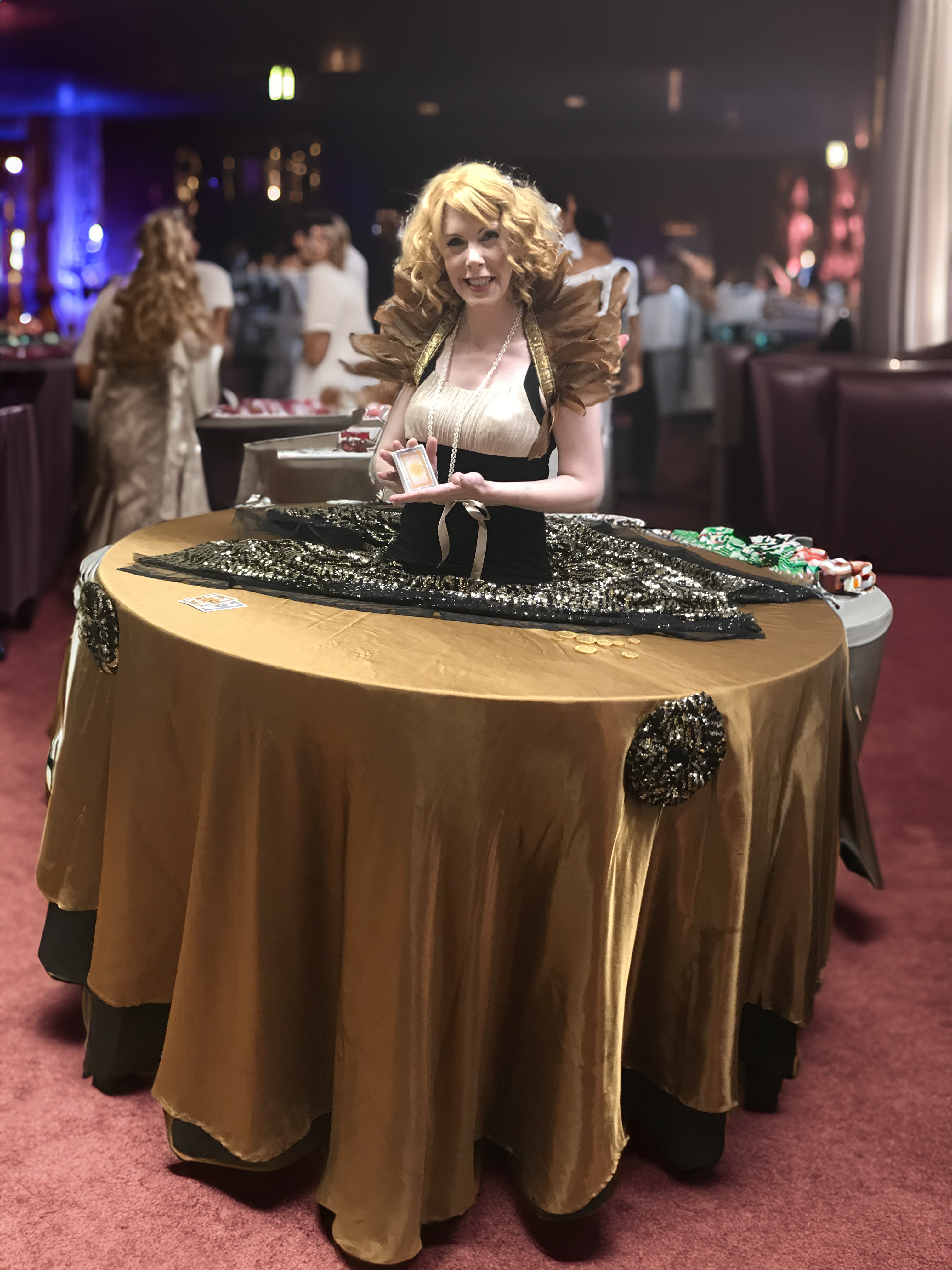 Gold and black 1920s themed strolling table is interactive.