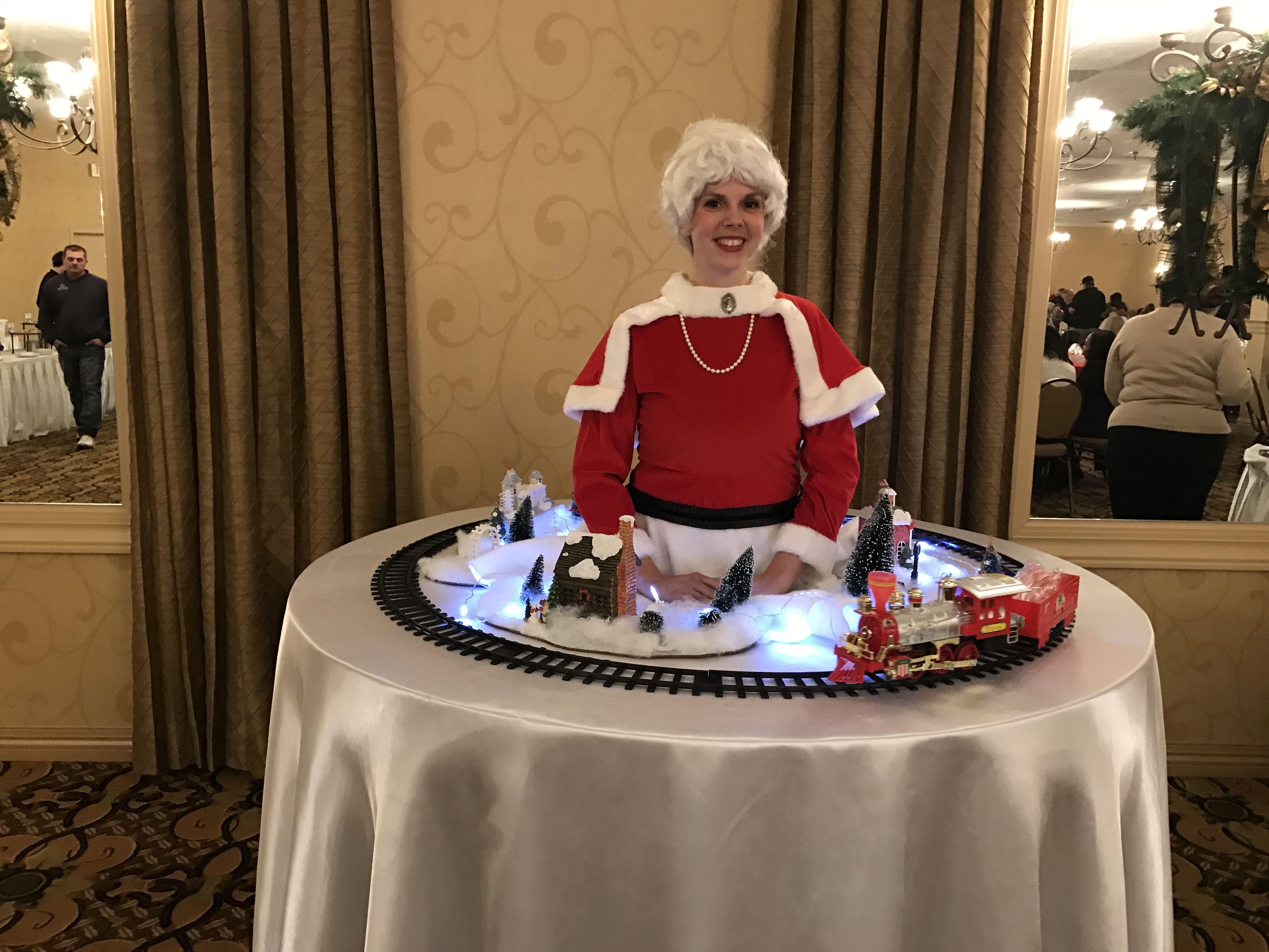 Mrs. Claus holiday strolling table toy train