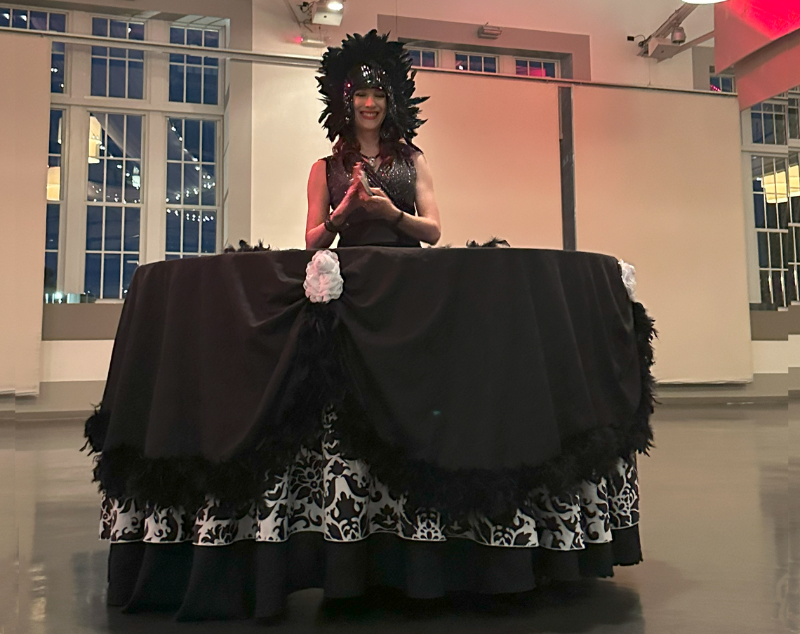 Black and white strolling table engages guests at your event in St. Louis.