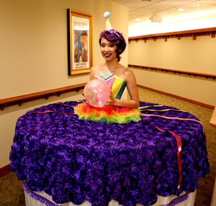 Celebration cake strolling table purple and rainbow